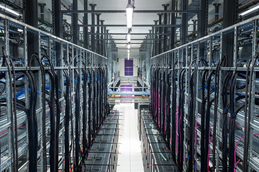 Racks, Wires and optical fibers in a modern datacenter Racks, Wires and optical fibers in a modern datacenter